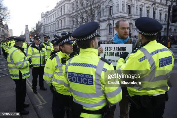 Demonstrator is confronted by police during a protest as Mohammed bin Salman, Saudi Arabia's crown prince, visits Theresa May, U.K. Prime minister,...