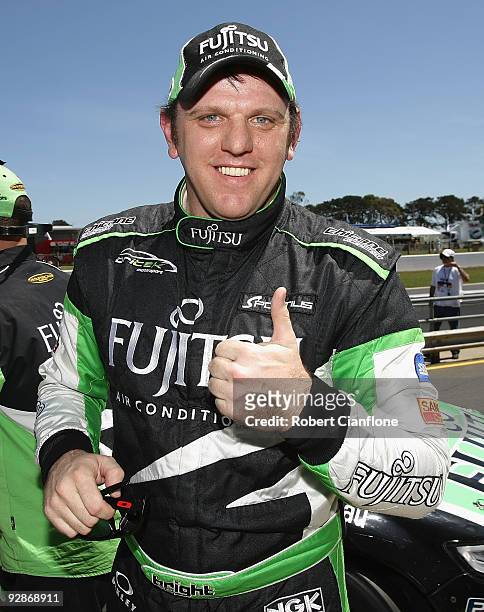 Jason Bright driver of the Britek Motorsport Ford gives the thumbs up after taking pole position for race 21 for round 12 of the V8 Supercar...