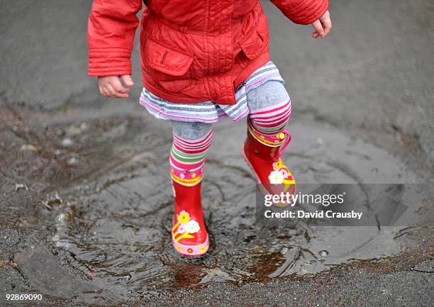 puddle stomping - wellington boots stock pictures, royalty-free photos & images