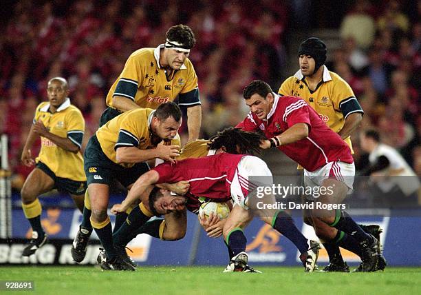 Tom Smith for the Lions drives against Michael Foley and George Smith for the Wallabies during the second Test Match between the Australian Wallabies...