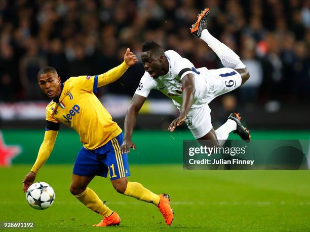 Douglas Costa of Juventus battle for the balls with Davinson Sanchez of Tottenham Hotspur during the UEFA Champions League Round of 16 Second Leg...