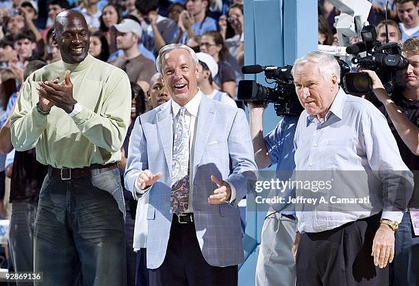 Former NBA basketball player Michael Jordan, North Carolina head coach Roy Williams and former head coach Dean Smith during introductions before...