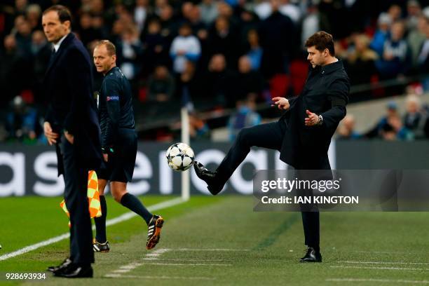 Tottenham Hotspur's Argentinian head coach Mauricio Pochettino kicks the ball back to the pitch during the UEFA Champions League round of sixteen...