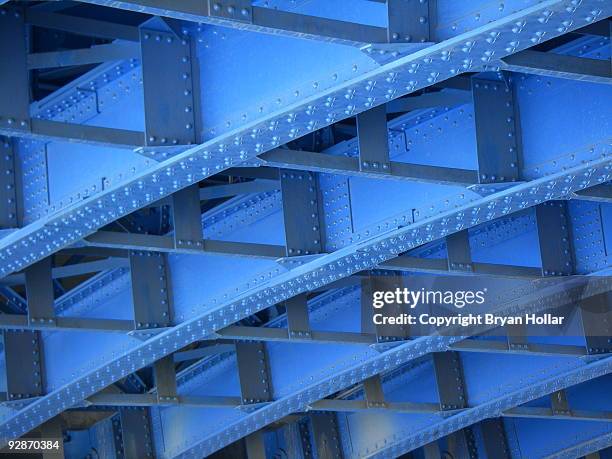 geometric under side of a blue bridge - rivet work tool stock pictures, royalty-free photos & images