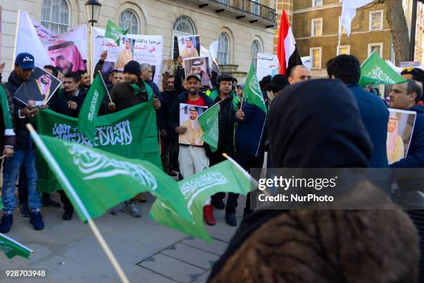 Demonstrators welcome Saudi Crown Prince, Mohammed bin Salman, as he visits Downing Street, London on March 7, 2018.