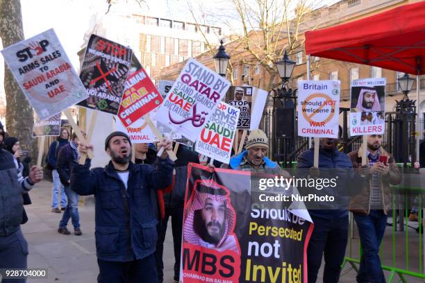 Protesters hold placards and chant in opposition to Saudi Crown Prince Mohammed bin Salman opposite Downing Street as the Crown Prince visits British...