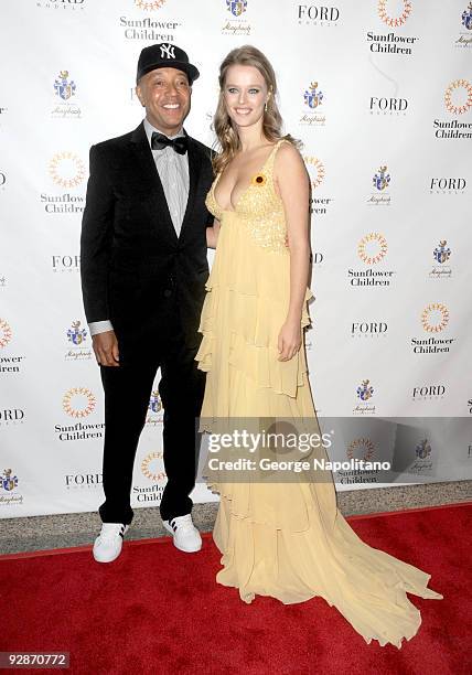 Russell Simmons and Helena Houdova,Founder of Sunflower Children attend the 3rd Annual Poker Fashion and Sports Gala at the Hammerstein Ballroom on...