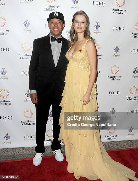 Russell Simmons and Helena Houdova,Founder of Sunflower Children attend the 3rd Annual Poker Fashion and Sports Gala at the Hammerstein Ballroom on...