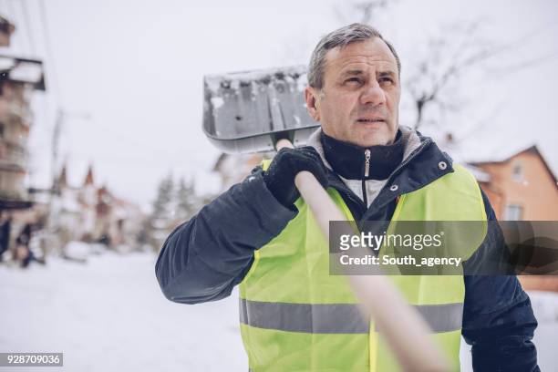 snow cleaning day - weather man stock pictures, royalty-free photos & images