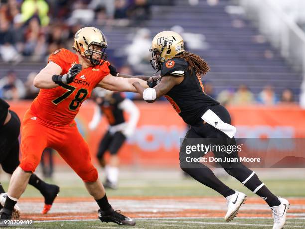 Linebacker Shaquem Griffin from Central Florida on the South Team is being blocked by Tackle Brett Toth from Amy-West Point on the North Team during...