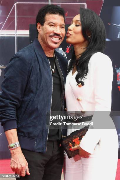 Lionel Richie and Lisa Parigi attend the Lionel Richie Hand And Footprint Ceremony at TCL Chinese Theatre on March 7, 2018 in Hollywood, California.