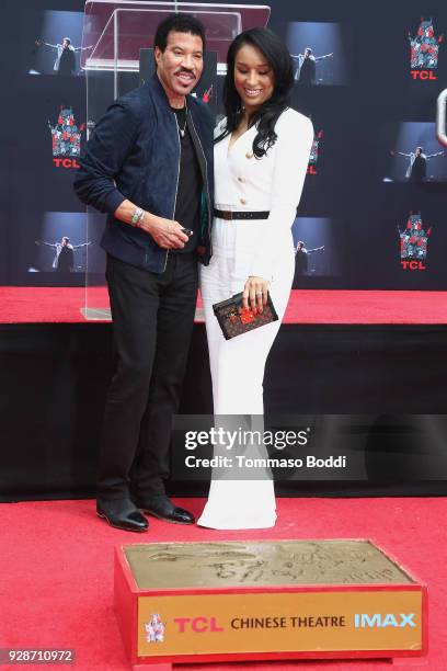 Lionel Richie and Lisa Parigi attend the Lionel Richie Hand And Footprint Ceremony at TCL Chinese Theatre on March 7, 2018 in Hollywood, California.