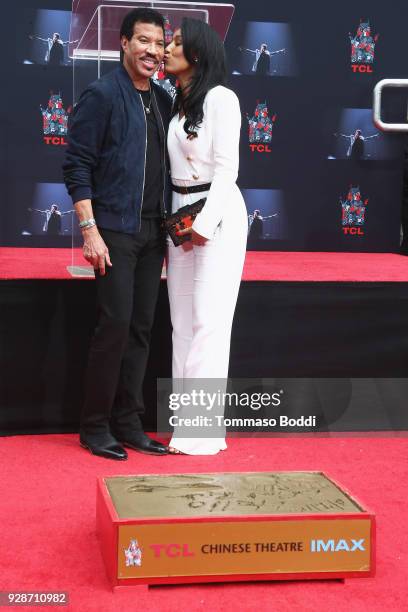 Lionel Richie and Lisa Parigi attend the Lionel Richie Hand And Footprint Ceremony at TCL Chinese Theatre on March 7, 2018 in Hollywood, California.