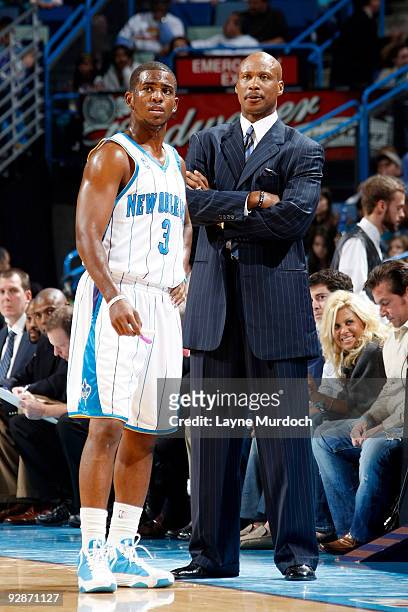 Chris Paul of the New Orleans Hornets speaks with head coach Byron Scott during their game against the Toronto Raptors on November 6, 2009 at the New...