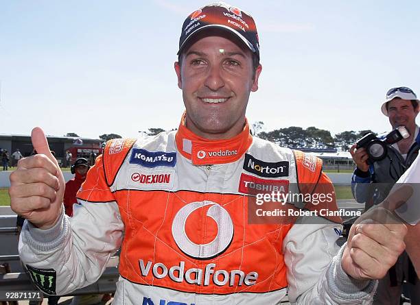 Jamie Whincup driver of the Team Vodafone Ford celebrates after winning race 21 in round 12 of the V8 Supercar Championship Series at Phillip Island...