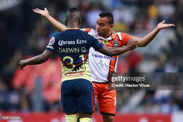 Darwin Quintero of America argues with Jesus Gonzalez of Tauro FC during the match between America and Tauro FC as part of the CONCACAF Champions...