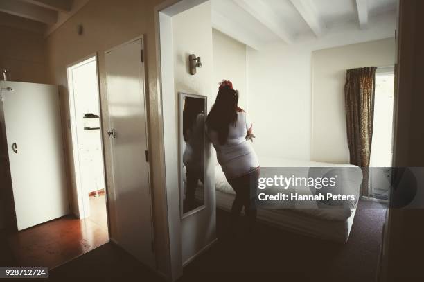 Sex worker waits ahead of her next booking at The Bach, an ethical escort service, on October 19, 2017 in Whangarei, New Zealand. Brothel Madame...