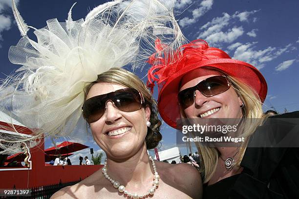 Race goers pose during Emirates Stakes Day at Flemington Racecourse on November 7, 2009 in Melbourne, Australia.