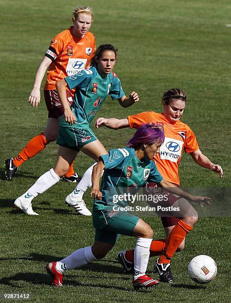Shu O Tseng of United is tackled during the round six W-League match between Canberra United and the Brisbane Roar at McKellar Park on November 7,...