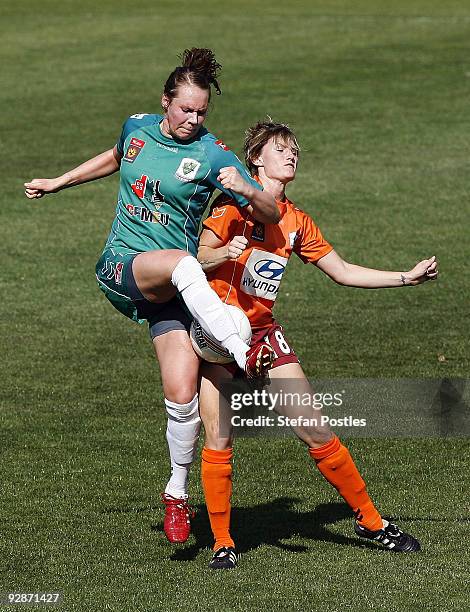 Bronwyn Studman of United and Courtney Beutel of the Roar compete for the ball during the round six W-League match between Canberra United and the...