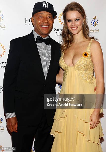 Russell Simmons and founder of Sunflower Children, Helena Houdova attend the Sunflower Children's 3rd Annual Poker, Fashion and Sports Gala at the...