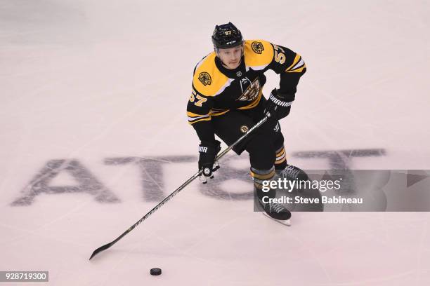 Tommy Wingels of the Boston Bruins skates with the puck against the Detroit Red Wings at the TD Garden on March 6, 2018 in Boston, Massachusetts.