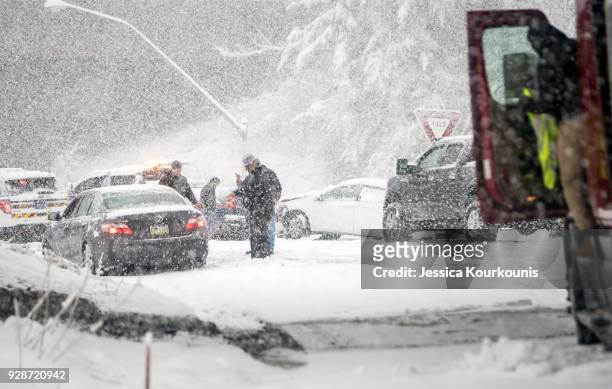 Pennsylvania State Troopers handle a car accident caused by winter weather on March 7, 2018 along the Pennsylvania Turnpike in Philadelphia,...