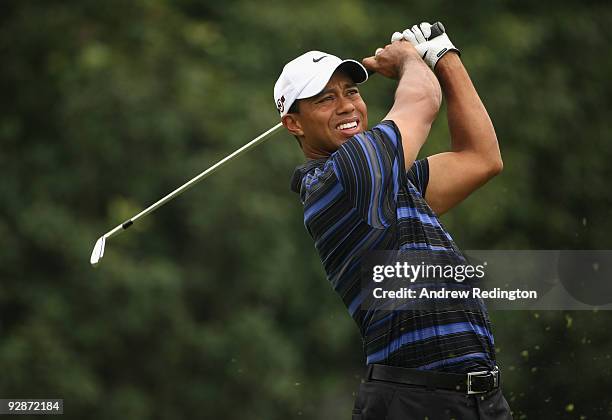 Tiger Woods of the USA watches his tee-shot on the fourth hole during the third round of the WGC-HSBC Champions at Sheshan International Golf Club on...