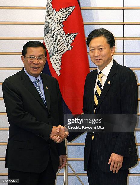 Cambodian Prime Minister Hun Sen shakes hands with Japanese Prime Minister Yukio Hatoyama prior to their bilateral meeting at Hatoyama's official...