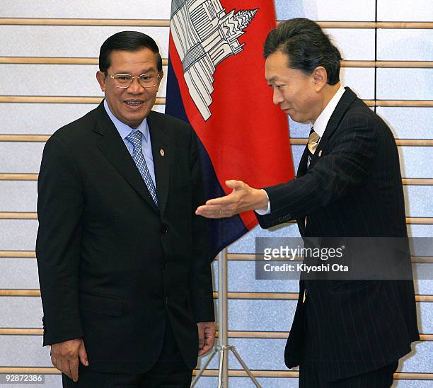 Cambodian Prime Minister Hun Sen is escorted by Japanese Prime Minister Yukio Hatoyama prior to their bilateral meeting at Hatoyama's official...
