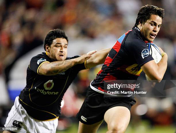 Sean Maitland of Canterbury breaks through the tackle of Piri Weepu of Welington to score during the Air New Zealand Cup Final match between...