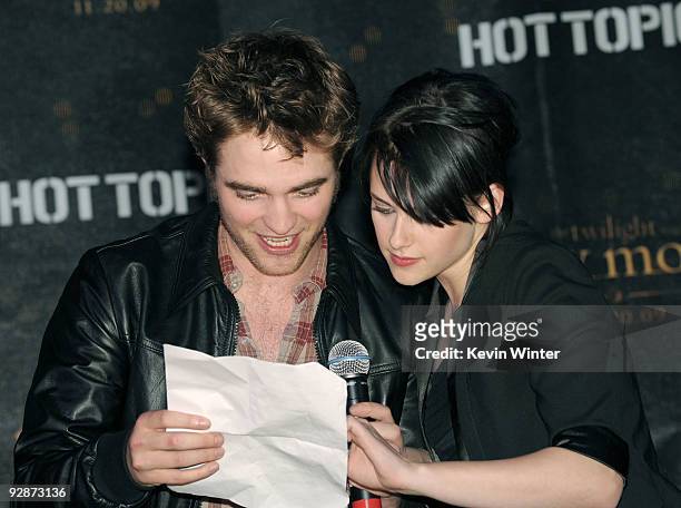 Actors Robert Pattinson and Kristen Stewart appear onstage at Summit's "The Twilight Saga: New Moon" Cast Tour at Hollywood and Highland on November...