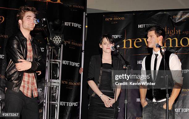 Actors Robert Pattinson, Kristen Stewart and Taylor Lautner appear onstage at Summit's "The Twilight Saga: New Moon" Cast Tour at Hollywood and...