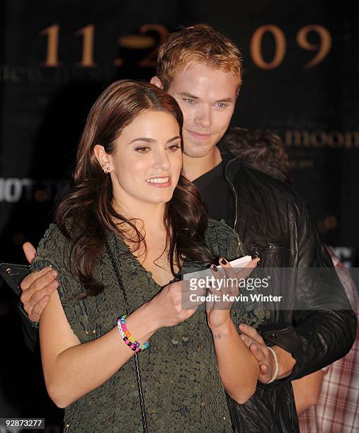 Actors Nikki Reed and Kellan Lutz appear onstage at Summit's "The Twilight Saga: New Moon" Cast Tour at Hollywood and Highland on November 6, 2009 in...