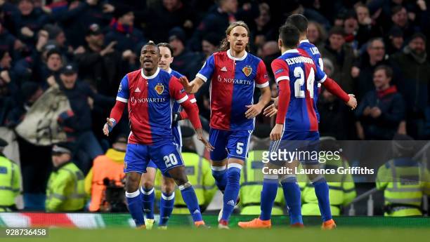Michael Lang of FC Basel celebrates with team mates after scoring his team's second goal of the game during the UEFA Champions League Round of 16...