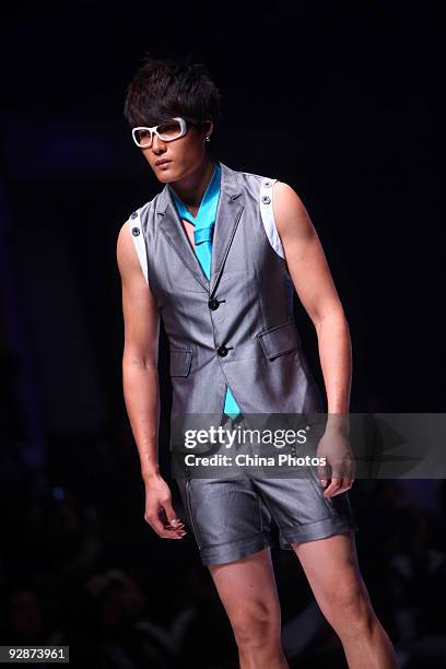 Model walks the runway in the 'ROMON' L&XF Men's Wear Fashion Show S/S 2010 during China Fashion Week on November 6, 2009 in Beijing, China.