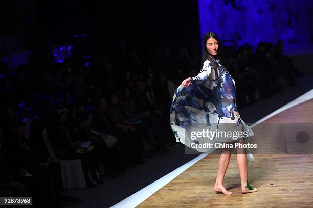 Model walks the runway in the BRJ Xiao Hong Fashion Show S/S 2010 during China Fashion Week on November 6, 2009 in Beijing, China.