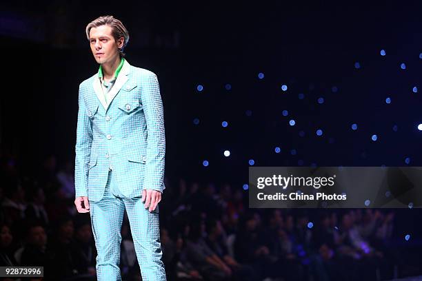 Model walks the runway in the 'ROMON' L&XF Men's Wear Fashion Show S/S 2010 during China Fashion Week on November 6, 2009 in Beijing, China.