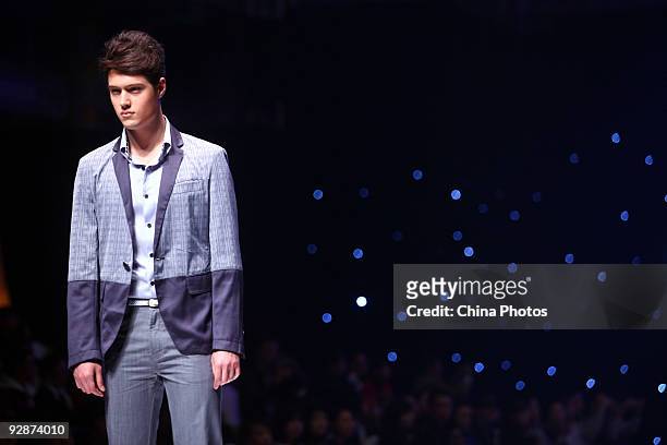 Model walks the runway in the 'ROMON' L&XF Men's Wear Fashion Show S/S 2010 during China Fashion Week on November 6, 2009 in Beijing, China.