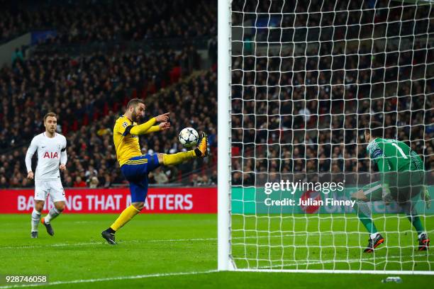 Gonzalo Higuain of Juventus scores the equalising goal during the UEFA Champions League Round of 16 Second Leg match between Tottenham Hotspur and...