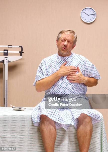 senior man with chest pains. - gastric acid stock pictures, royalty-free photos & images