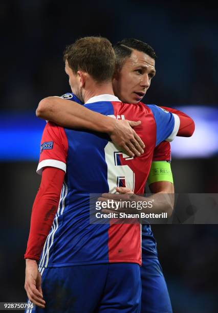Marek Suchy of FC Basel and team mate Fabian Frei celebrate their teams victory during the UEFA Champions League Round of 16 Second Leg match between...