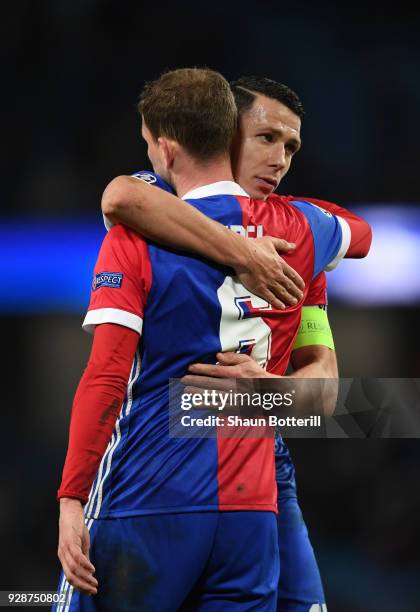 Marek Suchy of FC Basel and team mate Fabian Frei celebrate their teams victory during the UEFA Champions League Round of 16 Second Leg match between...