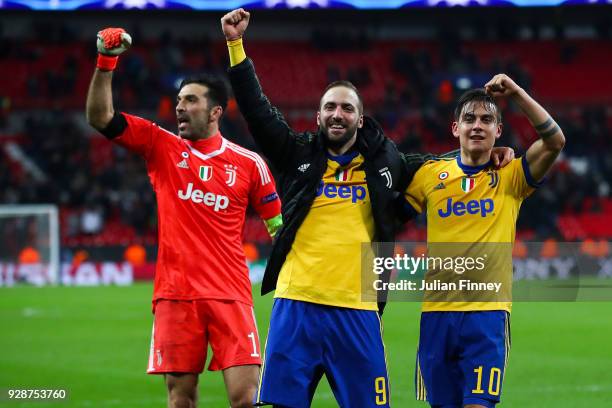 Gianluigi Buffon, Gonzalo Higuain and Paulo Dybala of Juventus celebrate at the end of the UEFA Champions League Round of 16 Second Leg match between...