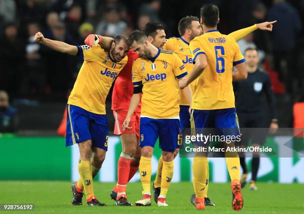 Giorgio Cheillini of Juventus and Miralem Pjanic of Juventus celebrate their victory during the UEFA Champions League Round of 16 Second Leg match...