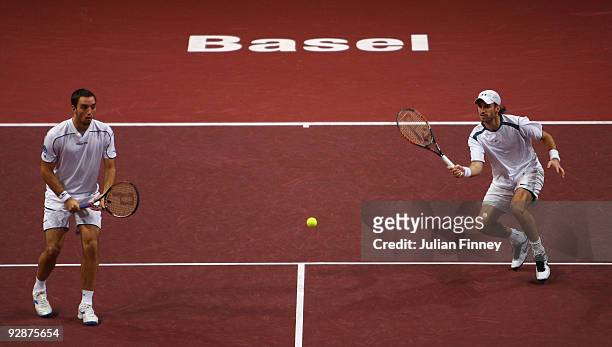 Christopher Kas of Germany and Viktor Troicki of Serbia in action in their doubles match against Daniel Nestor of Canada and Nenad Zimonjic of Serbia...