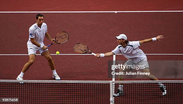 Christopher Kas of Germany and Viktor Troicki of Serbia in action in their doubles match against Daniel Nestor of Canada and Nenad Zimonjic of Serbia...