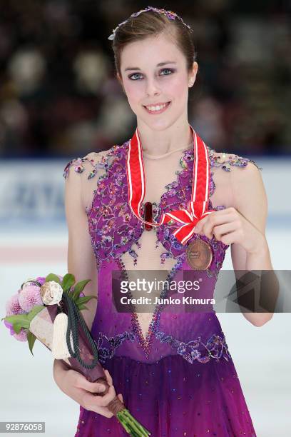 3rd place winner Ashley Wagner of the US poses for photographs after competing in the Ladies Free Skating on the day one of ISU Grand Prix of Figure...