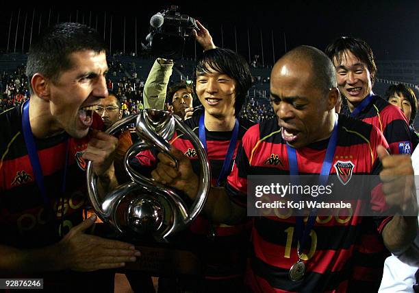 Stevica Ristikj and Denilson Martins Nascimento of Pohang Steelers celebrates after winning during 2009 AFC Champions League Final match between Al...