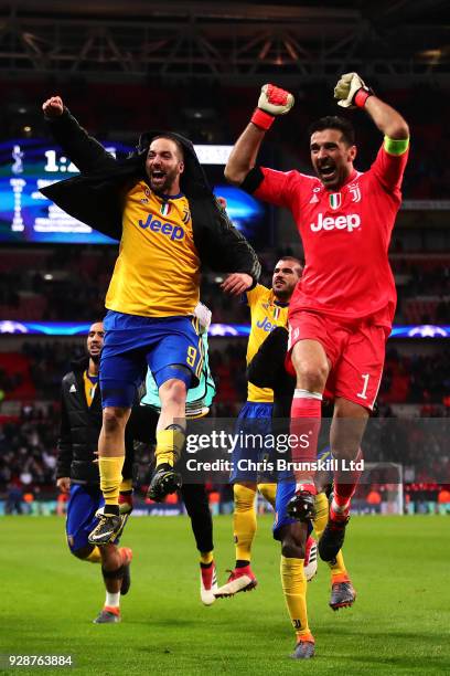 Gonzalo Higuain and Gianluigi Buffon of Juventus celebrate at full-time following the UEFA Champions League Round of 16 Second Leg match between...